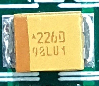 Tantalum capacitor, marked 226D 98LU1