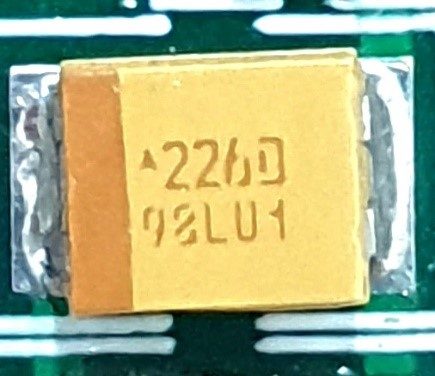 Tantalum capacitor, marked 226D 98LU1