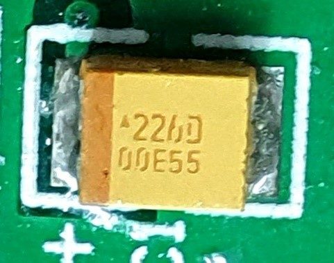 Tantalum capacitor, marked 226D 00E55