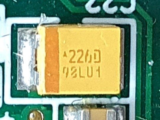 Tantalum capacitor, marked 226D 98LU1