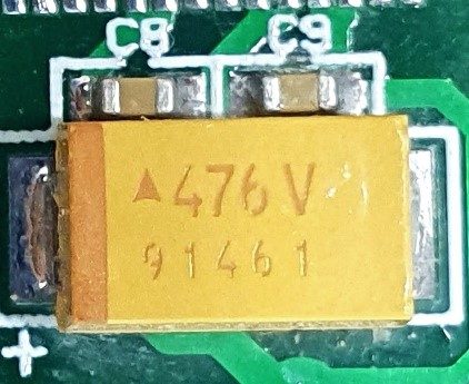 Tantalum capacitor, marked 476V 91461