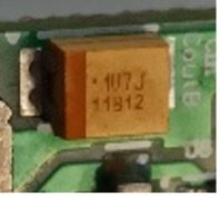 Tantalum SMD capacitor, marked 107 J 11B12