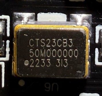 Clock oscillator 50MHz, marked CTS23CB3 50M000000 2233 313