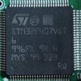 A 32-bit microcontroller, marked STM32F407VGT6 996PX 9R 4 MYS 99 323 RQ