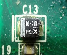 Tantalum capacitor, marked 10-20L P9
