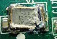 Quartz resonator, marked SJK 12.000 MHz