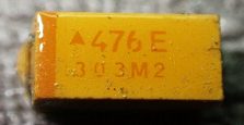 Tantalum capacitor, marked 476 E 303M2