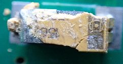 Tantalum capacitor, marked 150