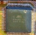 8-bit microcontroller with 128 KB programmable flash, marked Atmel ATMEGA128 16AU 1121