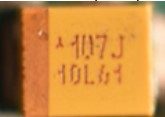 Tantalum SMD capacitor, marked 107J 10L61