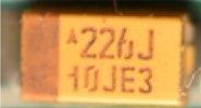 Tantalum SMD capacitor, marked 226J 10JE3