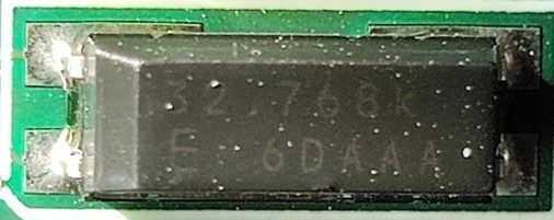 Quartz resonator, marked 32.768k E 6DAAA