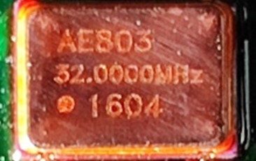 Oscillator AE 803 Series, marked AE803 32.0000MHz 1604