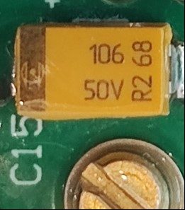 Tantalum capacitor, marked 106 50V R2 68