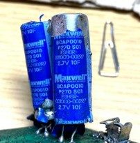 Condenser, marked ВСАР0010 Р270 S01 ESHSR-0010C0-00SR7 2.7V 10F