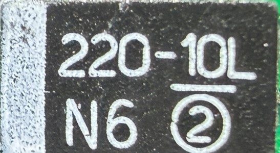 Tantalum capacitor, marked 220-10L N6