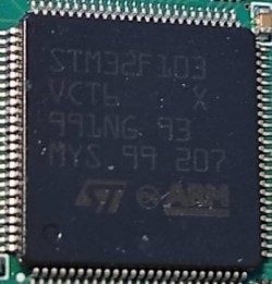 Microcontroller, marked STM32F103 VCT6 X 991NG 93 MYS 99 207