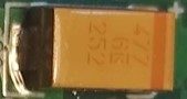 Tantalum capacitor, marked 477 6K